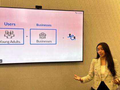 A woman presents her business idea as part of the New York Business Plan Competition at GSB.